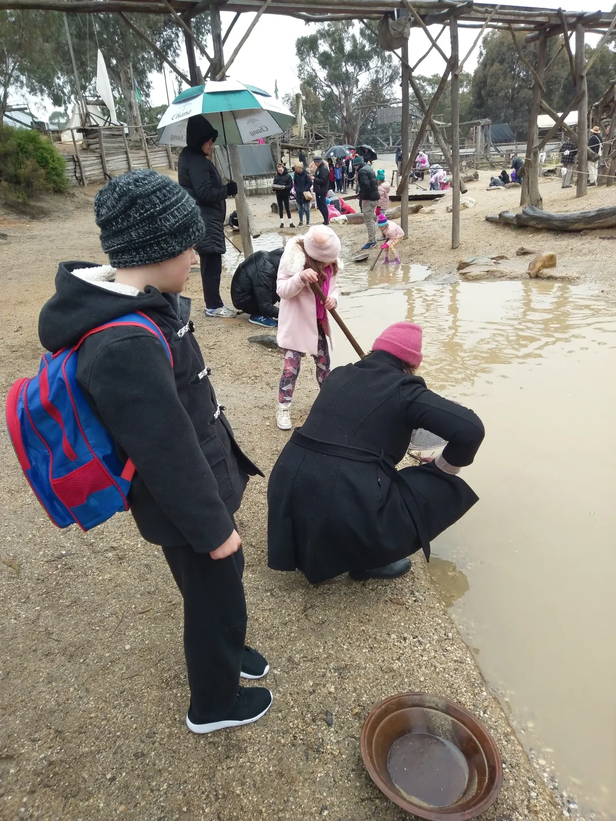 Children gold panning at the creek at Sovereign Hill