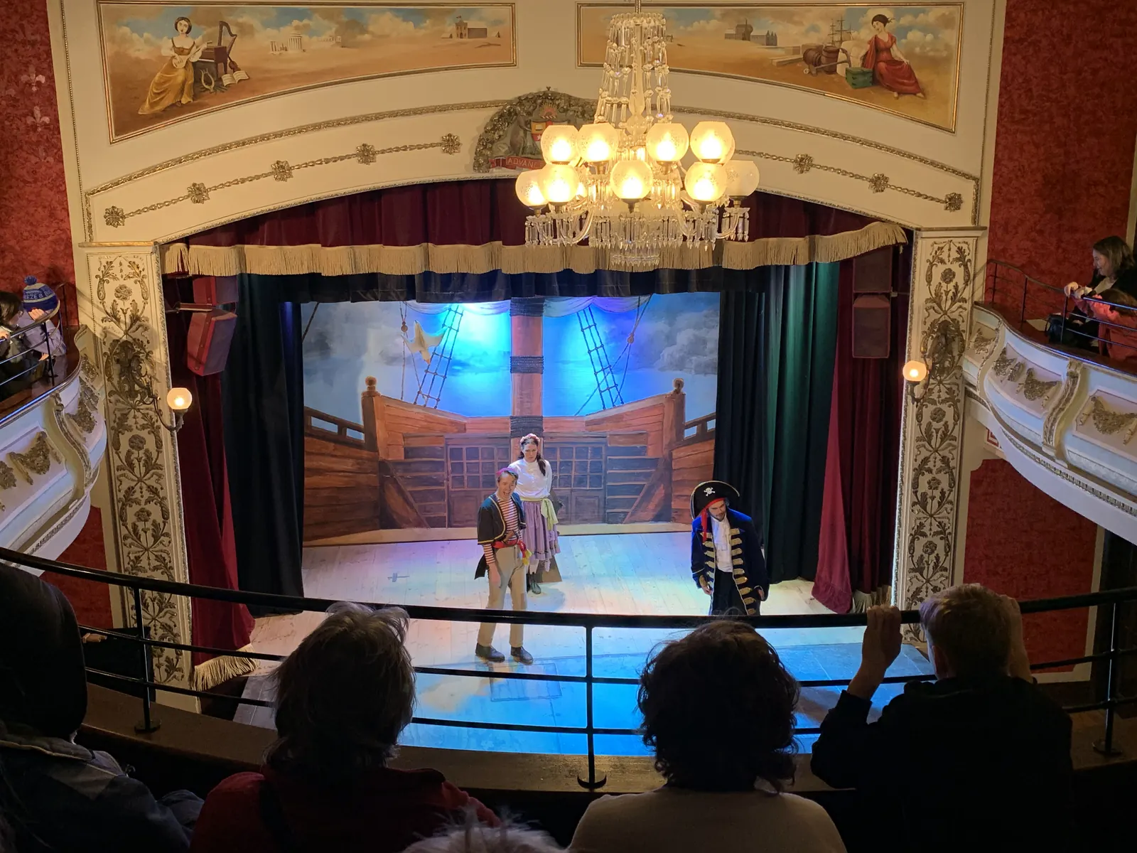 Actors performing a pirate-themed show on stage in the Sovereign Hill theatre