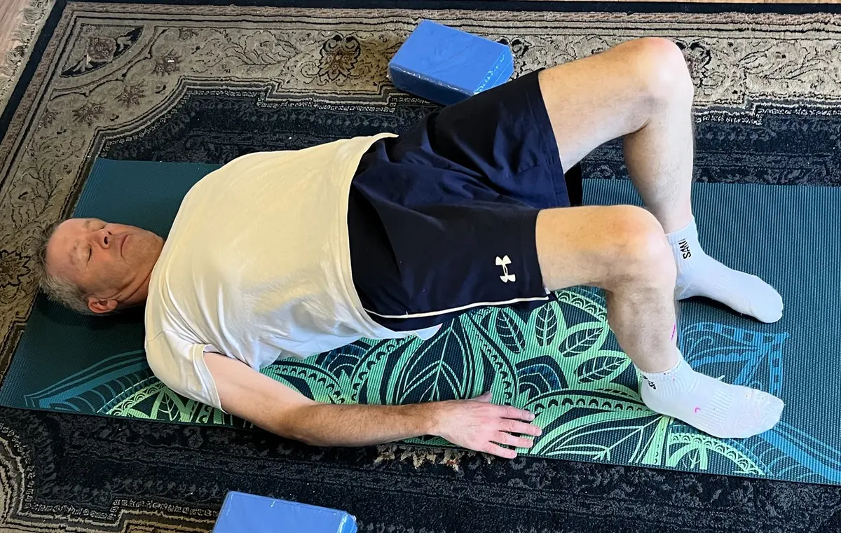 Glute bridge exercise on a mat at home