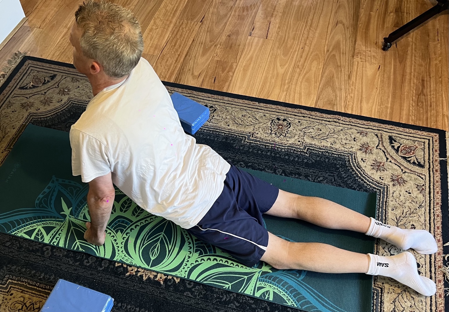 Supported back extension stretch on the mat