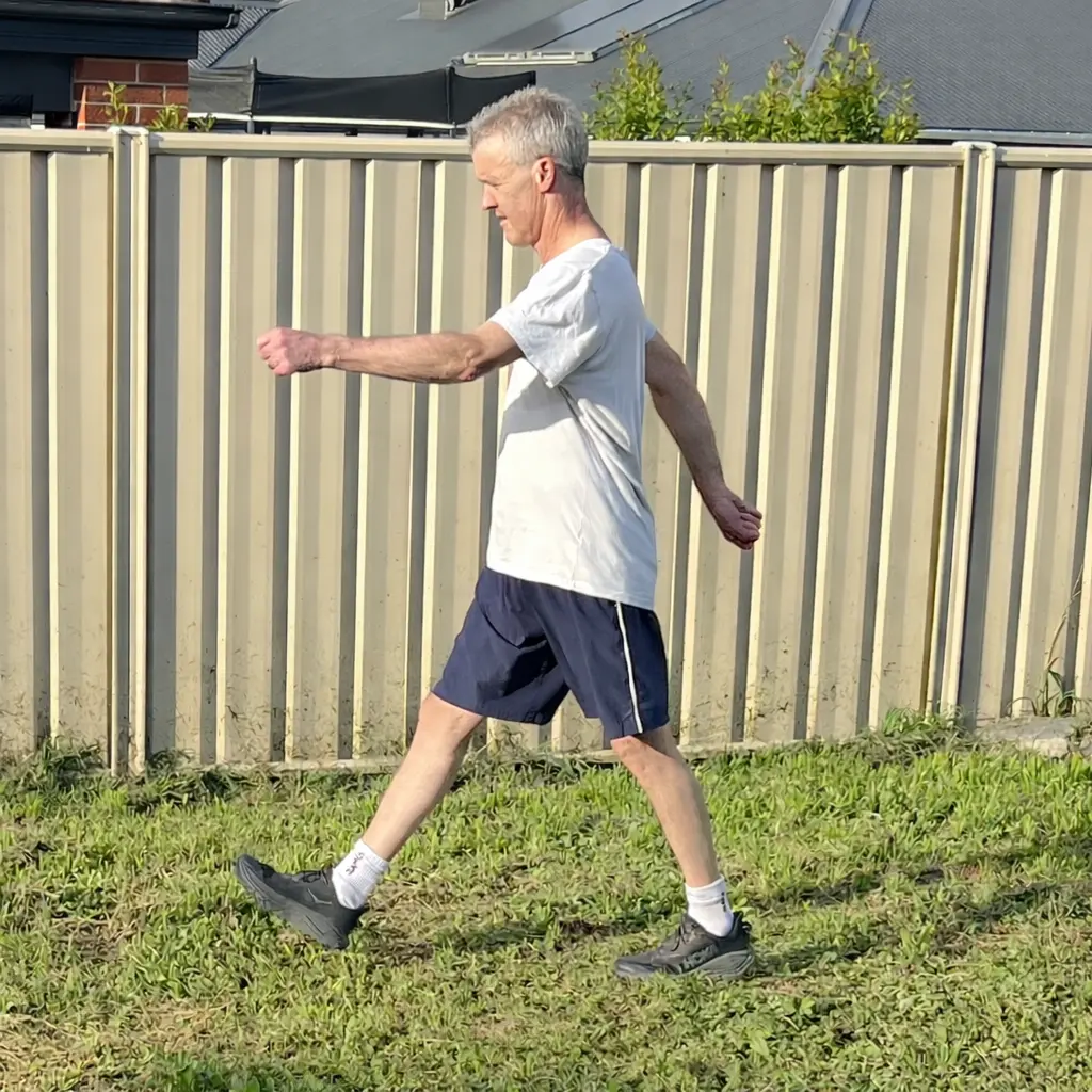 Brisk walk outdoors in the backyard